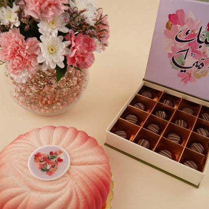 مزهرية نوّارة البيت مع كيك وشوكولا